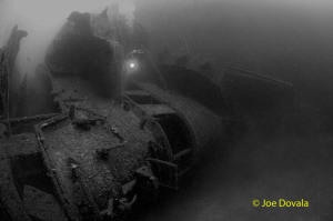 Scuba diver on bridge of the ship wreck HIJMS Nagato