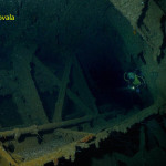 Scuba diver swims inside HIJMS Nagato.